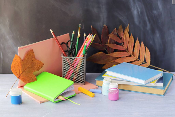 Back to school, books and blank notepad, stationery on the table, home learning concept - Photo, Image