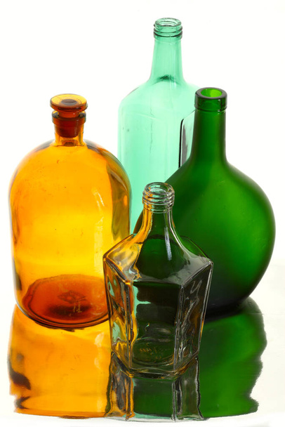 close-up of beautiful colorful empty bottles without caps isolated on white background studio - Photo, Image