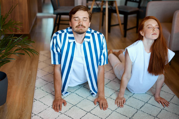 portrait of couple stretching before yoga - 写真・画像