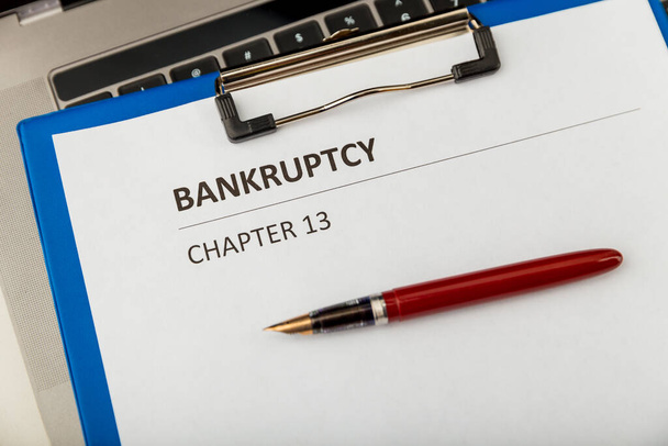 Bankruptcy concept. Document on the tablet. - Фото, изображение