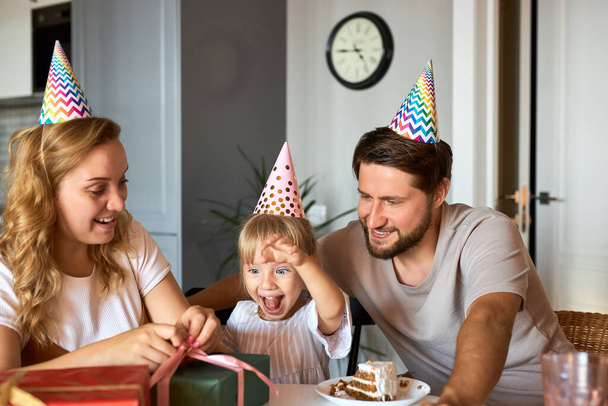 happy family congratulate daughters birthday in the kitchen - Photo, Image