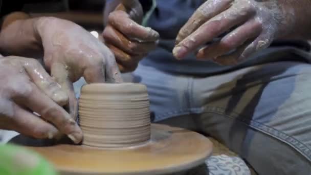 Making a handmade clay pot in the workshop. Pottery lesson with master. - Footage, Video