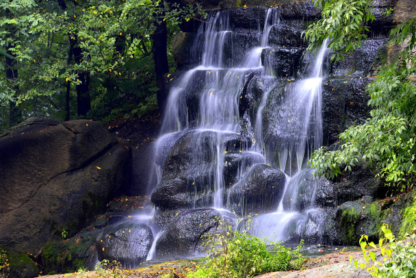 Picturesque beautiful waterfall falls from stones in Sofievsky park, Uman, Ukraine, long exposure - Photo, Image