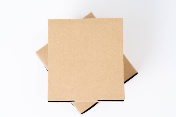 Brown paper box for food package. carton on a white background. - Foto, Bild