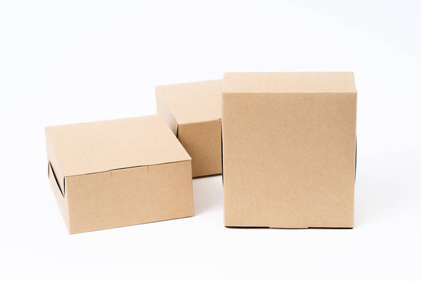 Brown paper box for food package. carton on a white background. - Foto, Bild