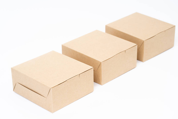 Brown paper box for food package. carton on a white background. - Фото, изображение