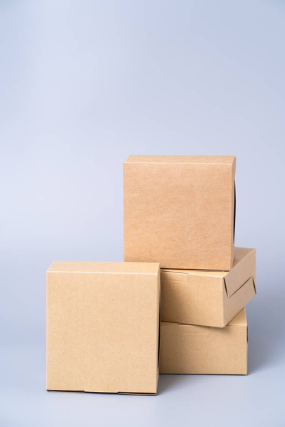 Brown paper box for food package. carton on a gray background. - Fotó, kép