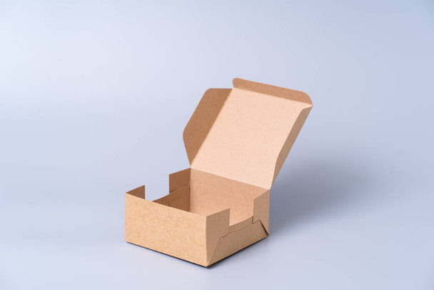 Brown paper box for food package. carton on a gray background. - Foto, immagini