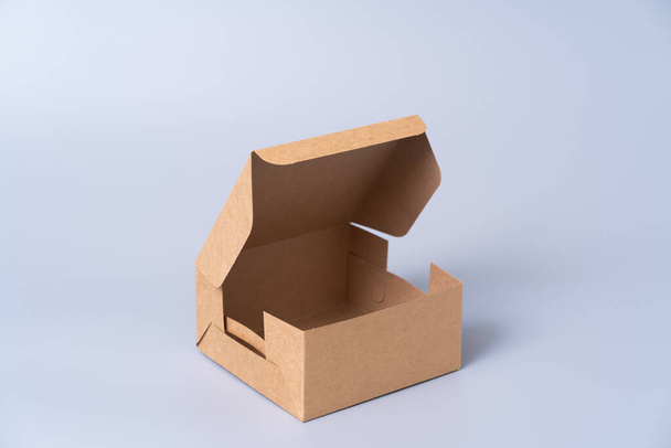 Brown paper box for food package. carton on a gray background. - Fotoğraf, Görsel