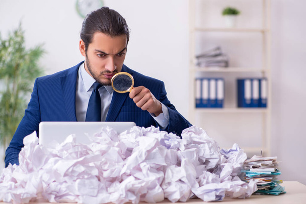 Businessman rejecting new ideas with lots of papers - Photo, Image