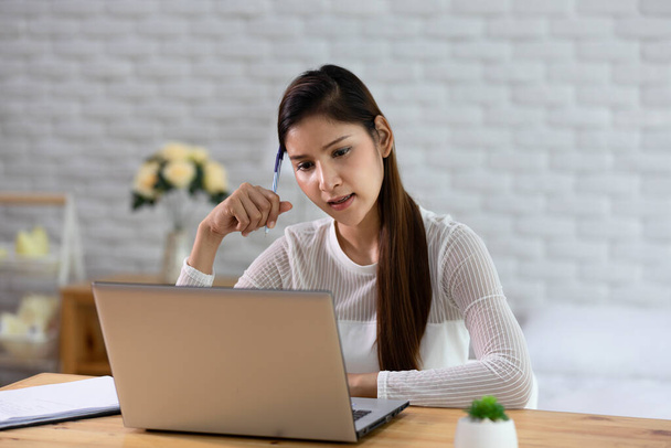 Business Asian indian woman working with computer laptop and thinking to get ideas and requirement in Small Business startup feeling so happiness at home,Small Business Startup Concept - Photo, Image