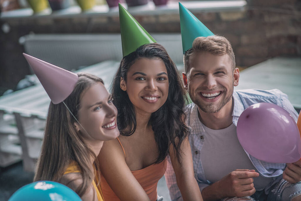 Joyful adult friends having a birthday party with balloons - Fotoğraf, Görsel