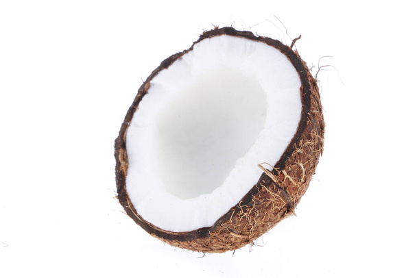 Fresh raw coconut with palm leaves isolated on white background. High resolution image - Photo, Image