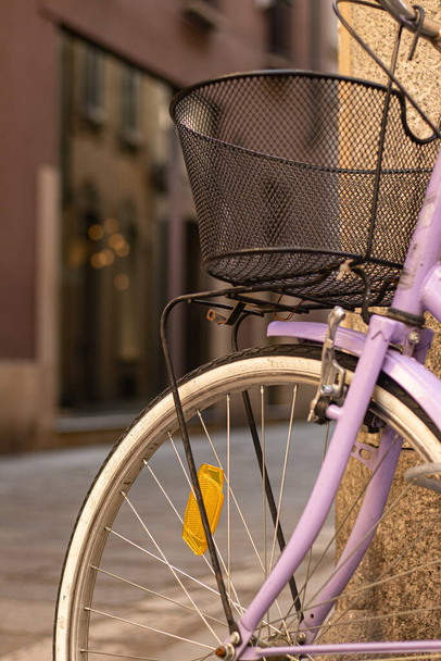 A selective focus shot of a bicycle with a basket - Fotoğraf, Görsel