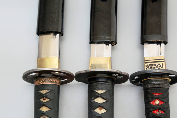 A top view of traditional Japenese Katana knives with covers - Foto, imagen