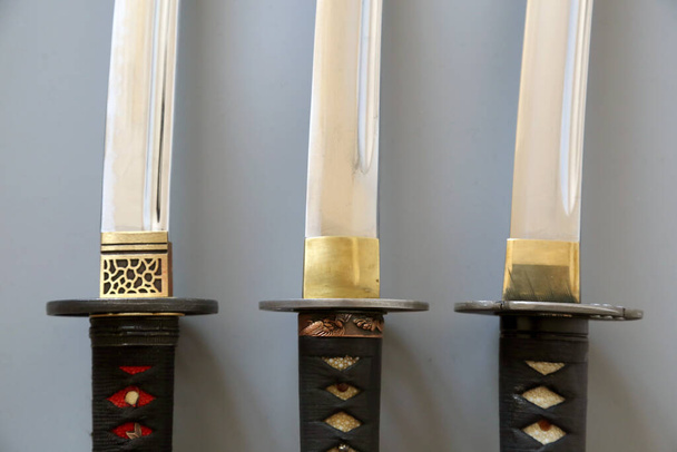 A top closeup view of traditional Japenese Katana swords - Фото, изображение
