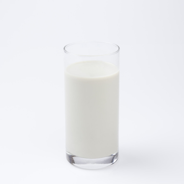 szója tej egy pohár fehér háttér - Fotó, kép