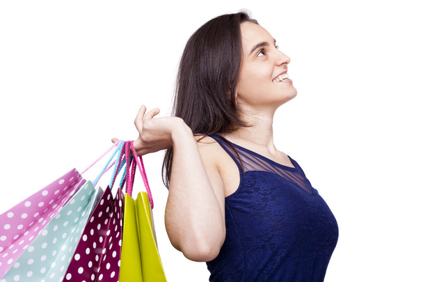 Portrait of a beautiful woman with shopping bags, isolated on wh - Foto, imagen