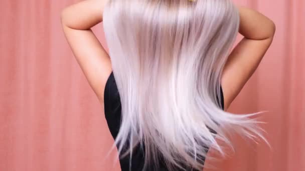Hair. Beautiful healthy long straight blonde hair close-up. Dyed white blond hair background, coloring, extensions, cure, treatment concept. Haircare. Slow motion 4K UHD video - Footage, Video
