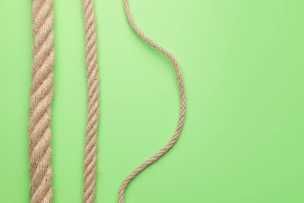 Long ropes on color background - Photo, Image