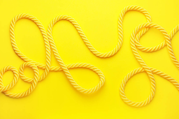 Long rope on color background - Фото, зображення