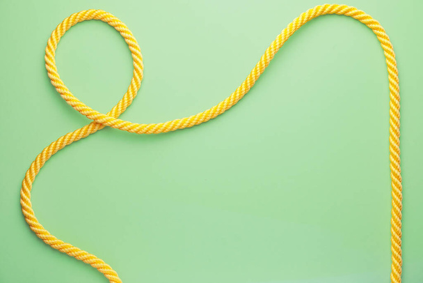 Long rope on color background - Zdjęcie, obraz