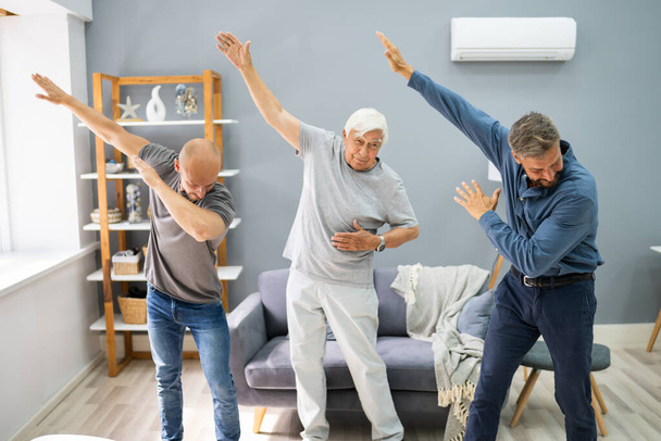 Three Generation Men Dancing And Exercising With Senior Grandpa - Photo, image