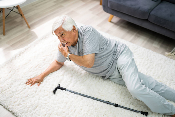 Elderly Senior Man Slip And Fall. Fallen Old Person - Фото, изображение