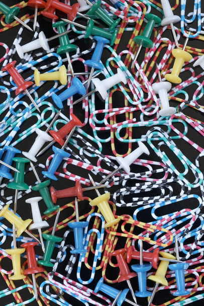Multicolored paper clips close-up on the black background macro photography - Fotografie, Obrázek