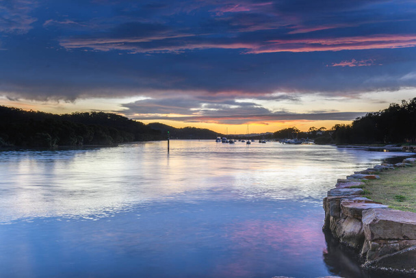 Clouds and Potential for Rain - Sunrise Waterscape at Woy Woy Waterfront on the Central Coast, NSW, Australia. - 写真・画像