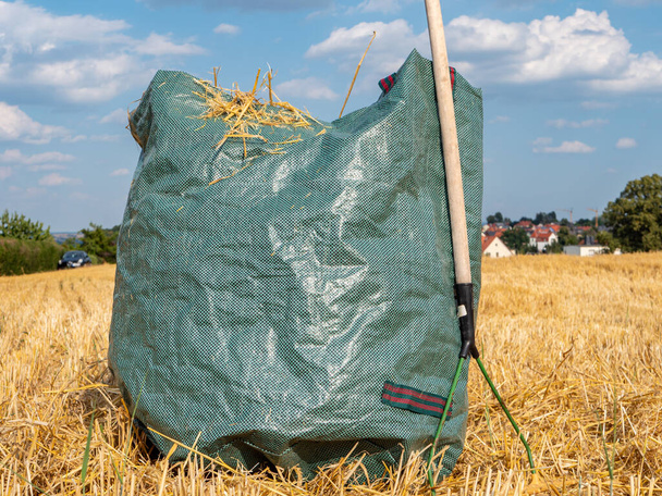 straw harvest bag rake on a field - Photo, Image