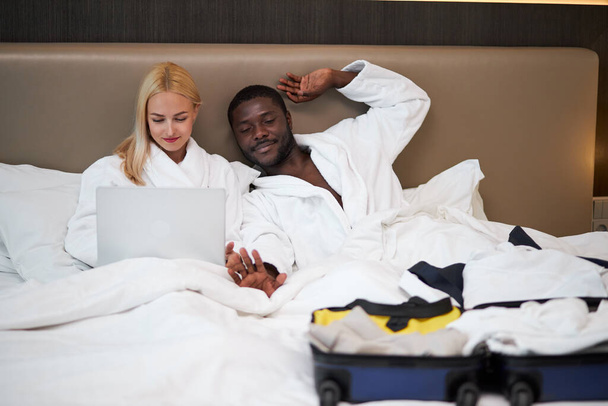 couple on bed in hotel - 写真・画像