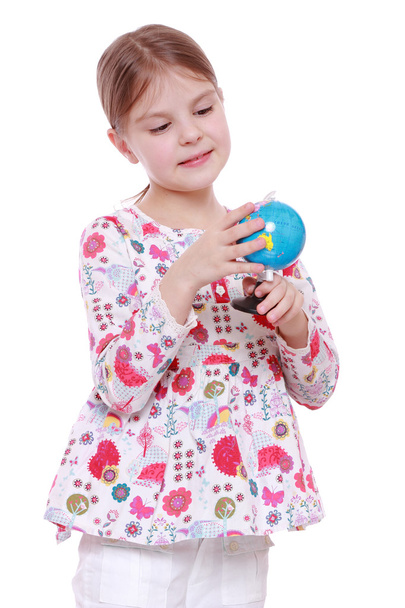 Girl with the globe in hands - Photo, image