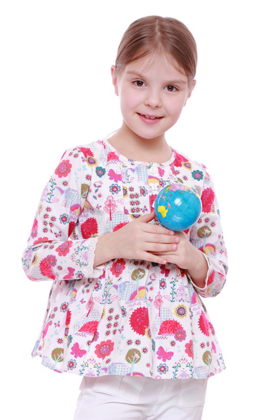 Girl with the globe in hands - Фото, зображення