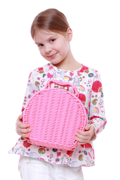 Girl with a pink basket - Фото, изображение