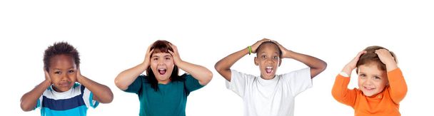 Children covering the ears and shocked by a loud sound isolated on a white background - Foto, imagen
