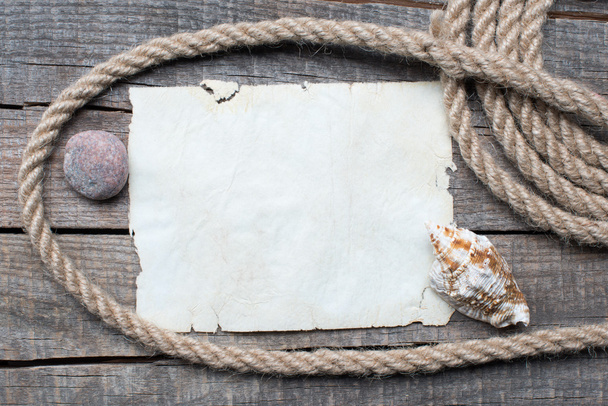 Ship rope, sea shells, notebook and old wood background - Photo, Image