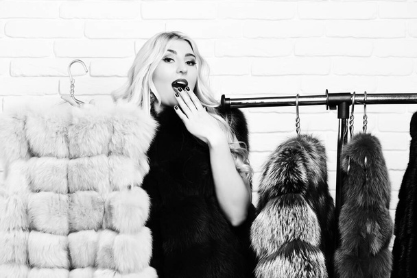 fashionable sexy woman in fur on brick wall studio background - Zdjęcie, obraz