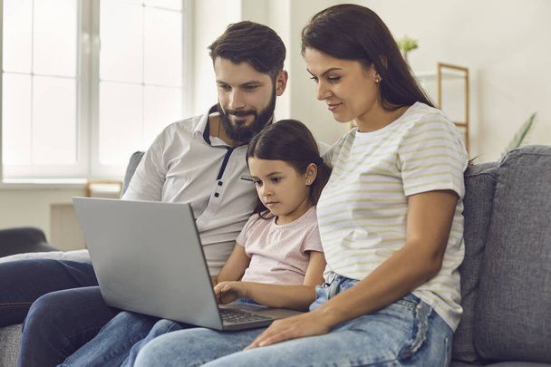 Family with daughter waiting video call for online doctor consultation on laptop at home - Φωτογραφία, εικόνα