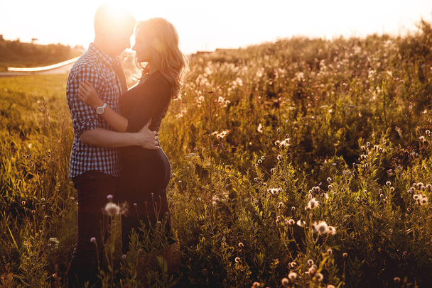 Happy couple in love having fun in the field outdoors - Foto, Imagem