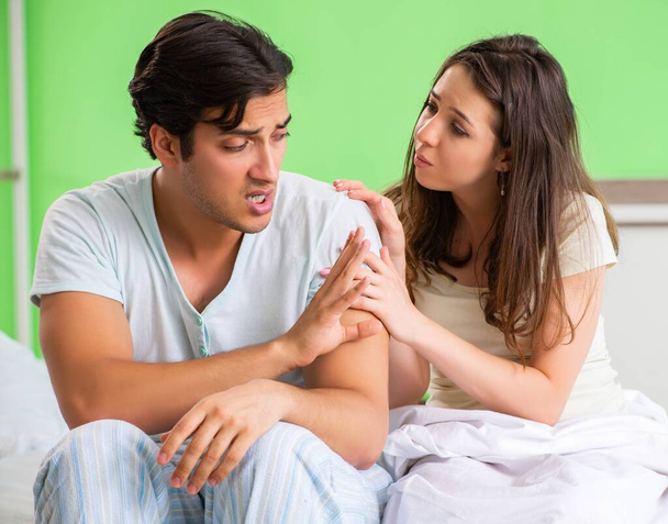 Young woman consoling disappointed impotent husband - Photo, Image