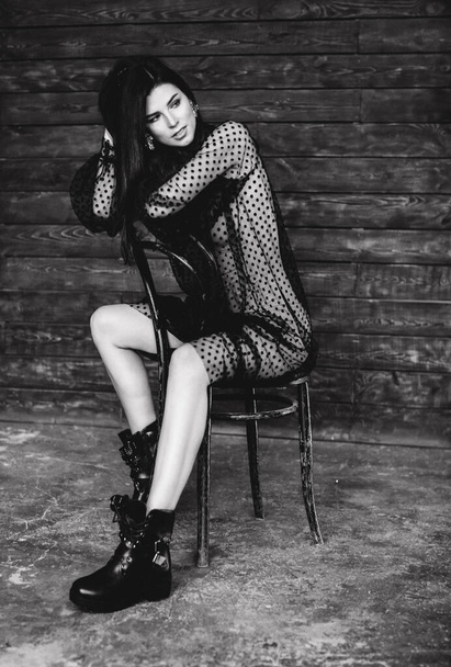 attractive sexy woman posing in studio, black and white photo - 写真・画像