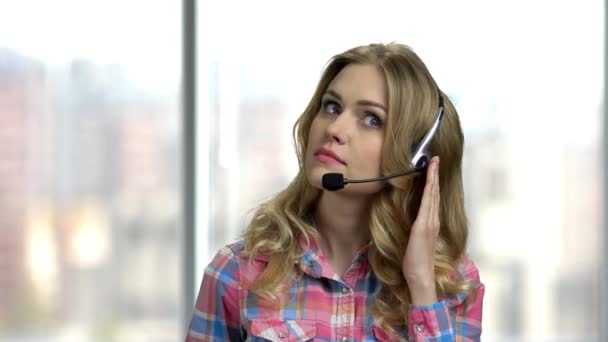 Beautiful consultant of call center on blurred background. - Footage, Video