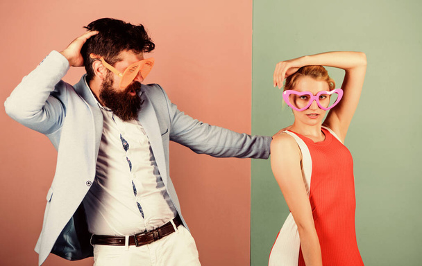 Dancing together. Couple having fun. Office party. Celebrating success. Good mood. Relax and have fun. Corporate culture. Celebrating holiday. Bearded man pretty woman party goggles celebrating - Photo, image