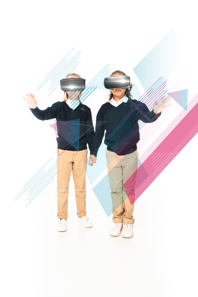 full length view of multicultural schoolgirls holding hands while using virtual reality headsets on white background, abstract illustration - Фото, зображення
