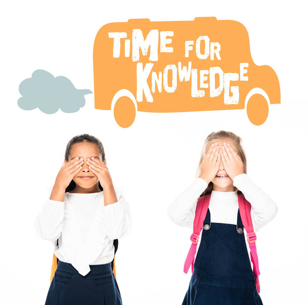multicultural schoolgirls covering faces with hands isolated on white, time for knowledge illustration - Foto, imagen