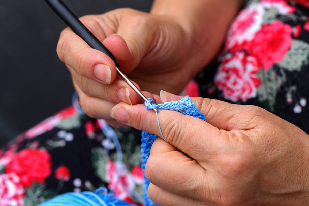 A closeup of a caucasian female knitting a toy - Fotoğraf, Görsel