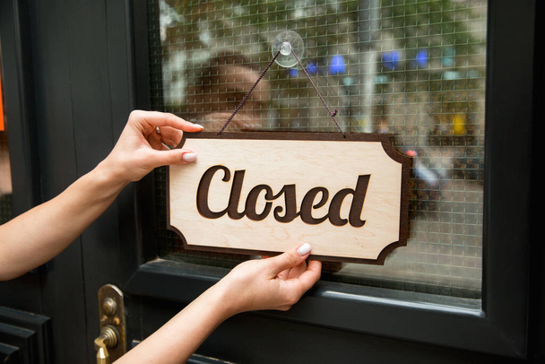 Closed sign on the glass of street cafe or restaurant - Photo, Image