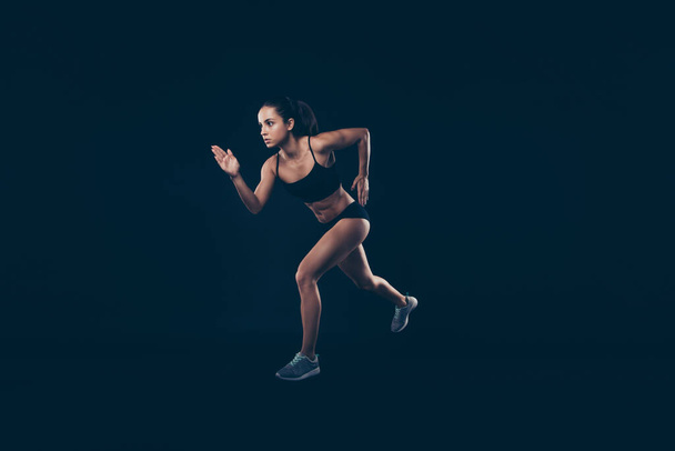 Full size profile photo short sport suit lady sprint run jogger inspired to win race first place member isolated black background - Fotoğraf, Görsel