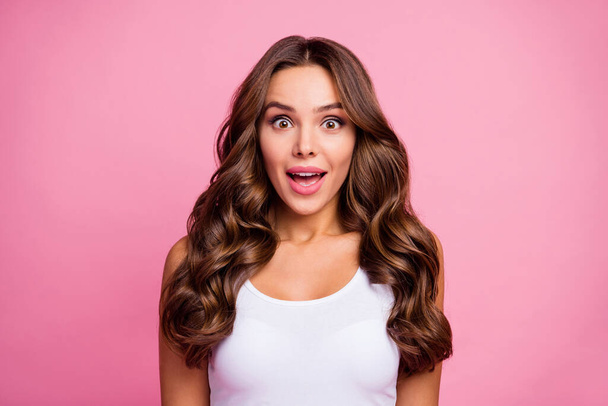 Photo of pretty funny wavy lady crazy facial expression open mouth listen cool news amazing successful day wear white casual singlet isolated bright pink color background - Fotó, kép